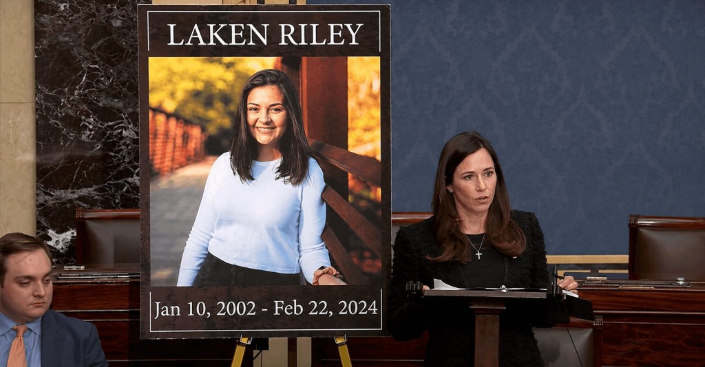 Lawmaker speaks beside a memorial image of Laken Riley during congressional debate on immigration enforcement legislation.