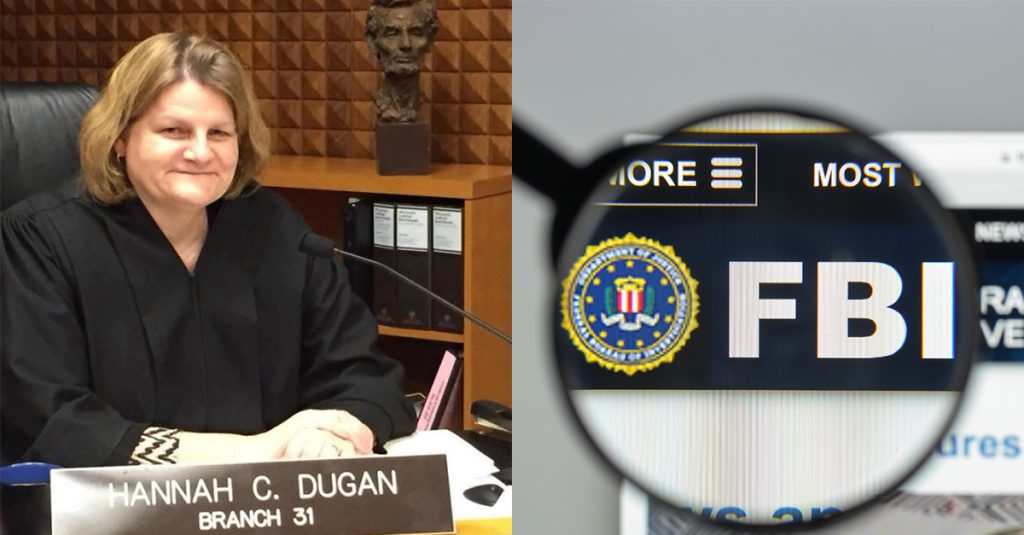 Milwaukee County Judge Hannah C. Dugan sits at the bench; beside her is an image of the FBI logo seen through a magnifying glass.
