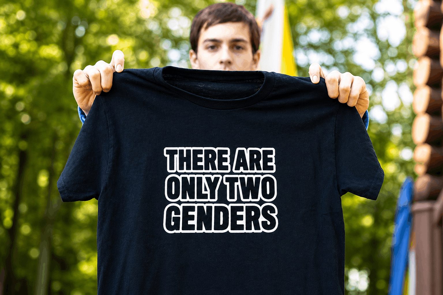 Student holding a black T-shirt that reads “There Are Only Two Genders,” representing Liam Morrison’s Supreme Court student free speech case.