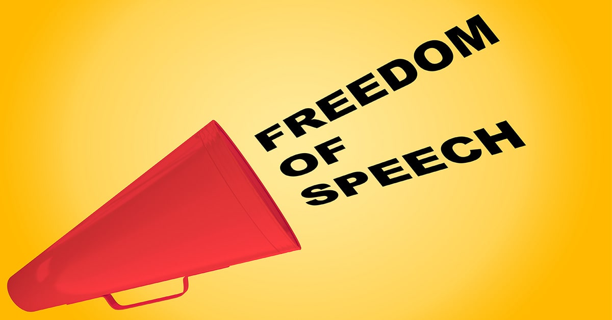 Bullhorn declares, "Freedom of Speech!"