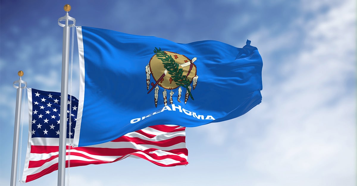 The flags of Oklahoma and the U.S. on flagpoles