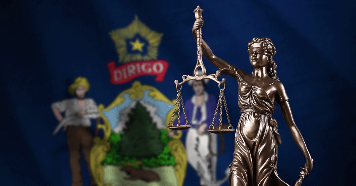 State flag of Maine and Lady Justice holding the balancing scales