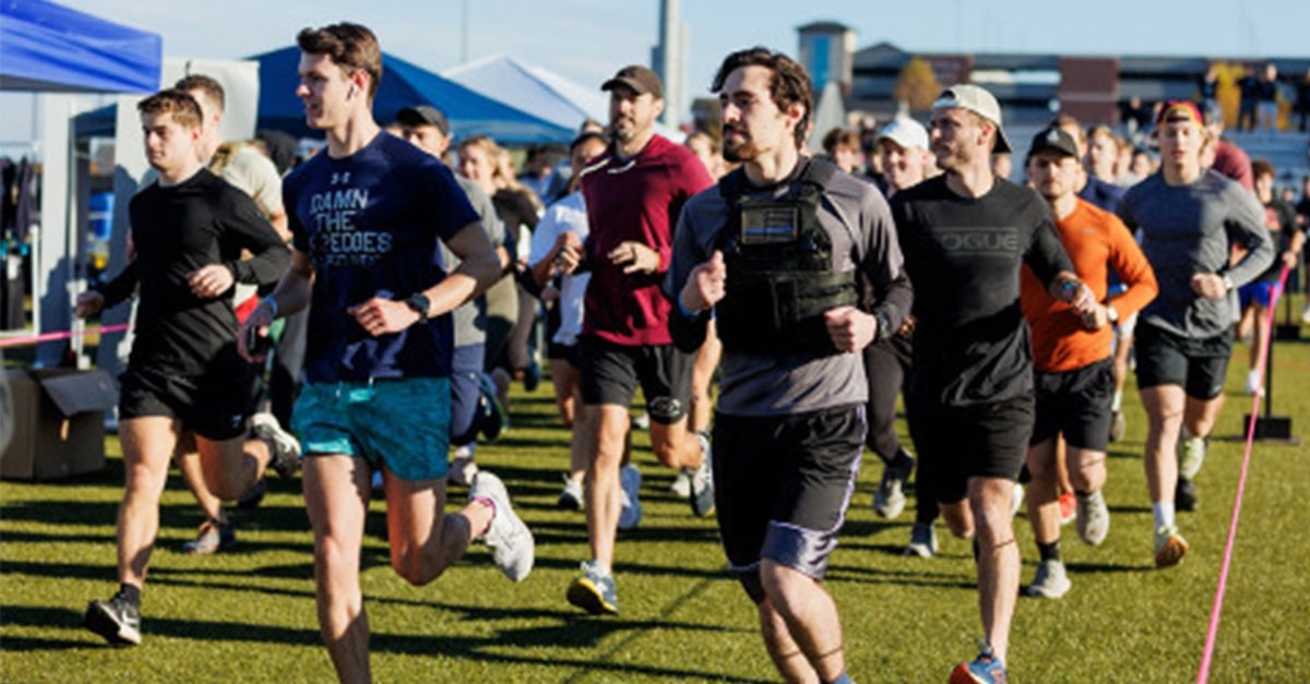 A large group of participants race as part of the LU Murph Challenge.