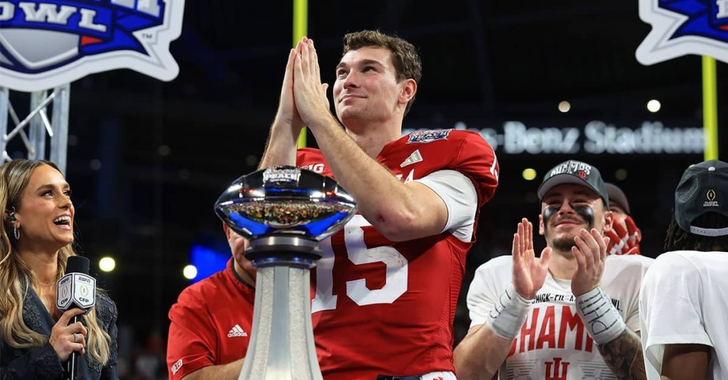 Indiana quarterback Fernando Mendoza holds his hands together in prayer and looks at the sky after the Hoosiers won the Peach Bowl on January 9, 2026.