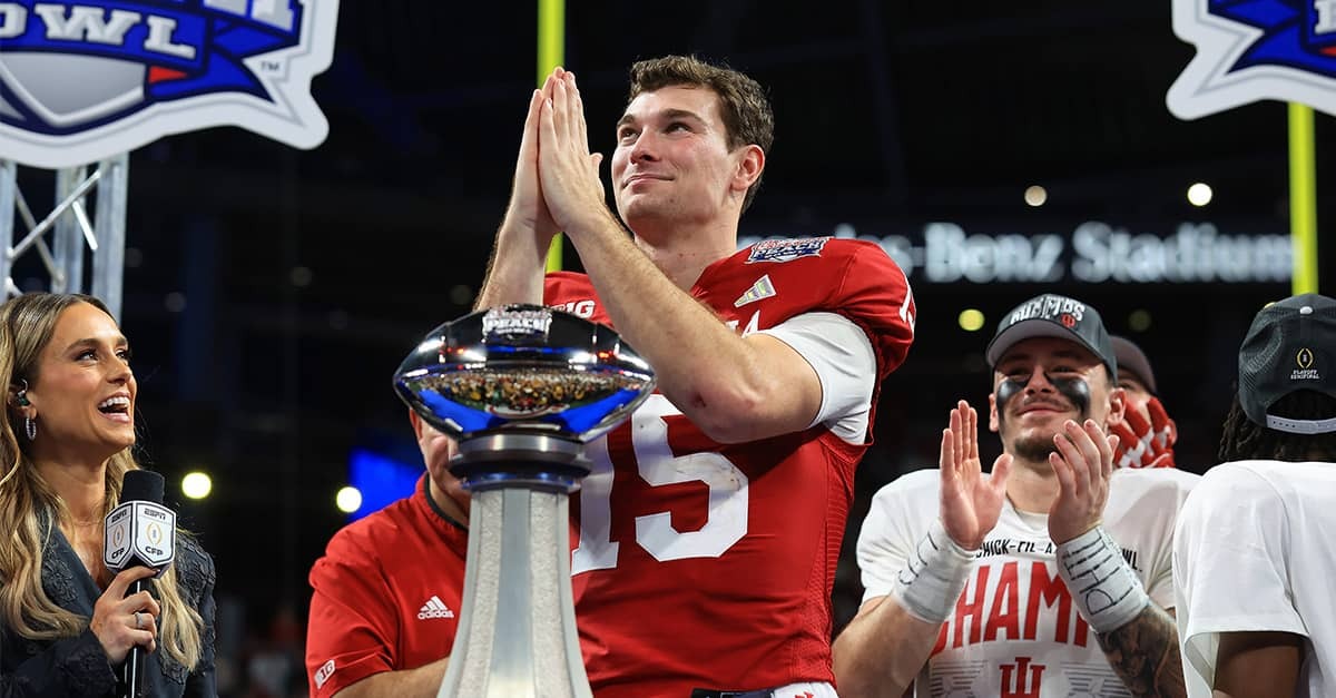 Indiana quarterback Fernando Mendoza holds his hands together in prayer and looks at the sky after the Hoosiers won the Peach Bowl on January 9, 2026.