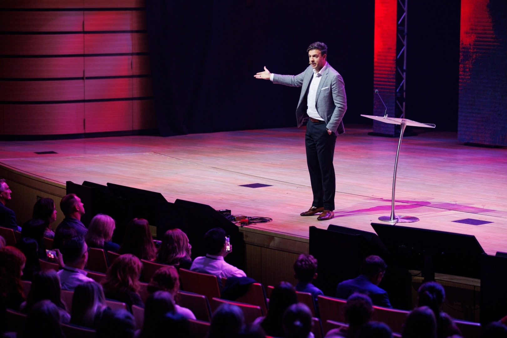 Seth Gruber with his hand outstretched speaking at the 2025 Freedom Uncensored event