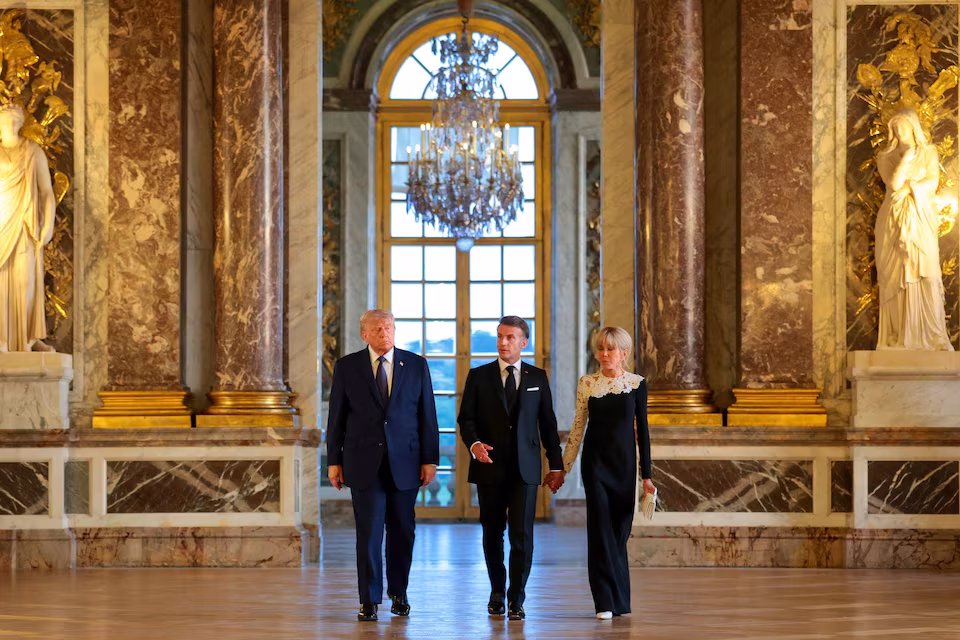 President Donald Trump tours Château de Versailles with French President Emmanuel Macron ahead of a diplomatic dinner.