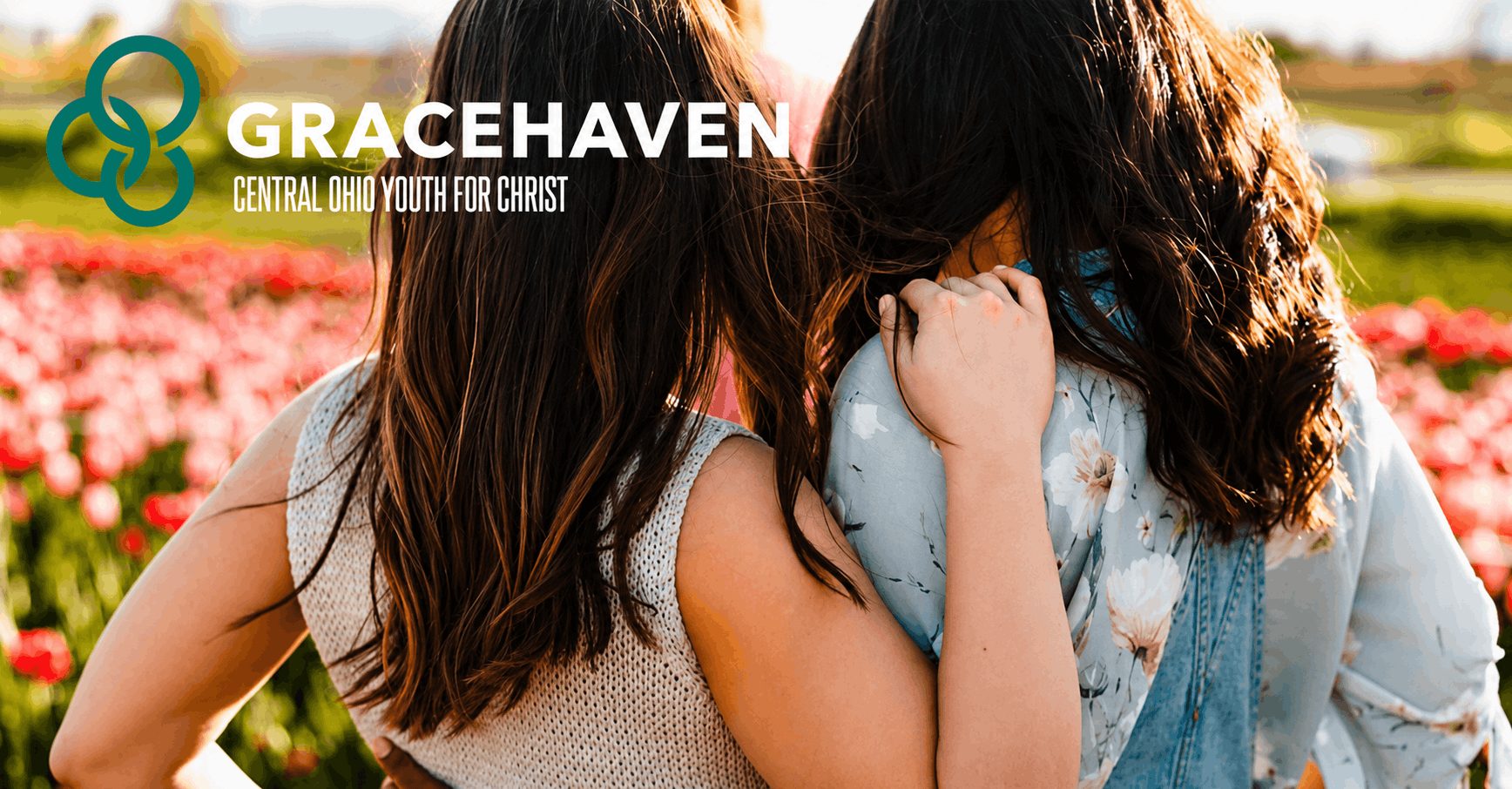 An ad showing two young girls from the back and the works "Gracehaven: Central Ohio Youth for Christ"