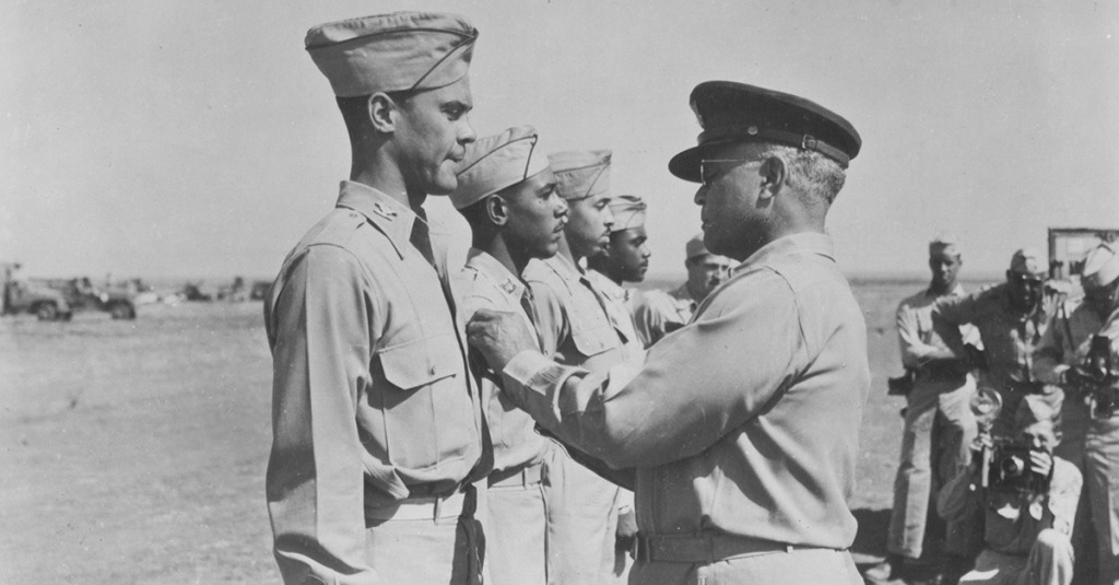 Brig. Gen. Benjamin O. Davis Sr. pins a medal on his son, then-Col. Benjamin Davis Jr., in Italy in 1944.