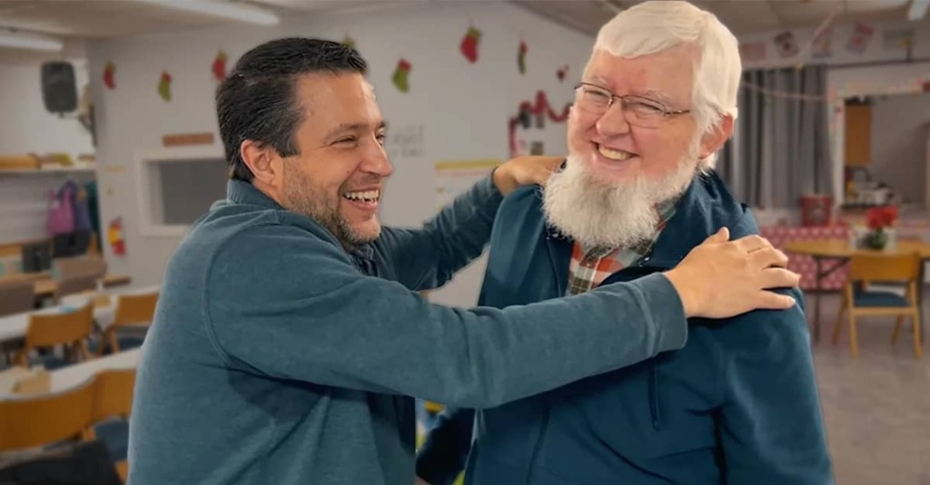 Pastor Chris Avell with a homeless man at Dad's Place Church in Bryan, Ohio.